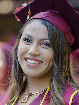 female grad with necklace