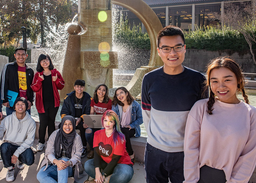 group of students in front of Sunken Garden fountain