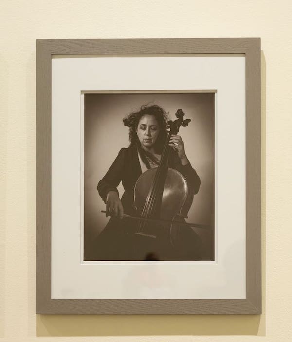 photo of woman playing cello