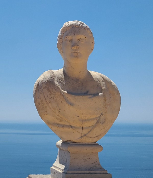 marble bust against blue sky