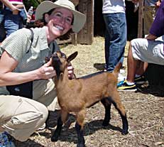 Instructor with a goat during a  class field trip