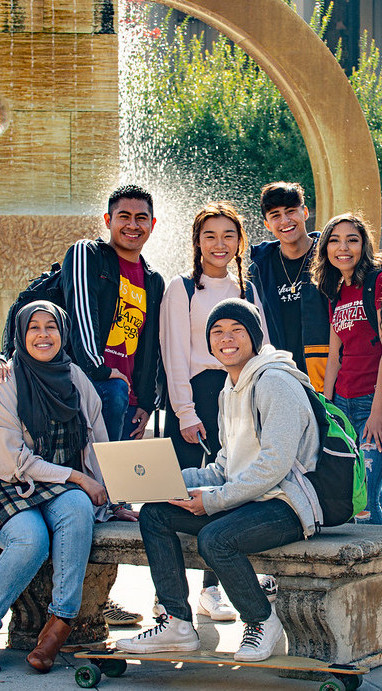 students at fountain in Sunken Garden