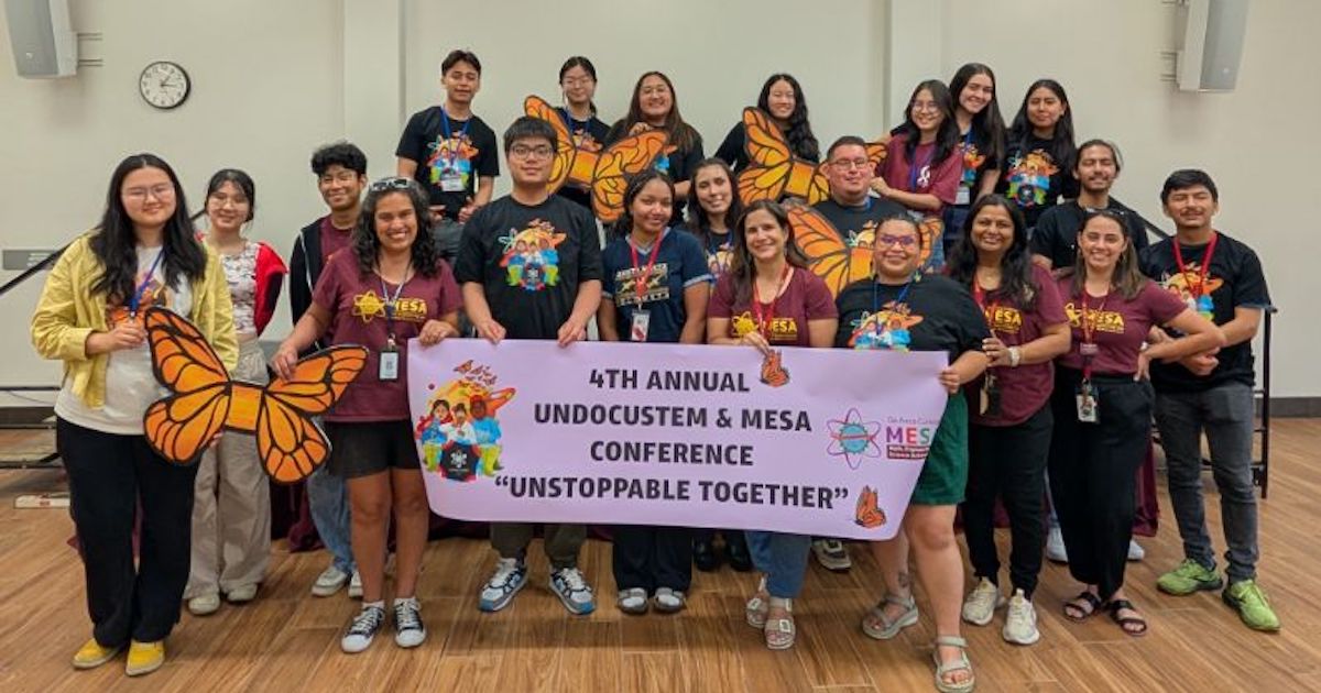 students lined up behind UndocuSTEM banner