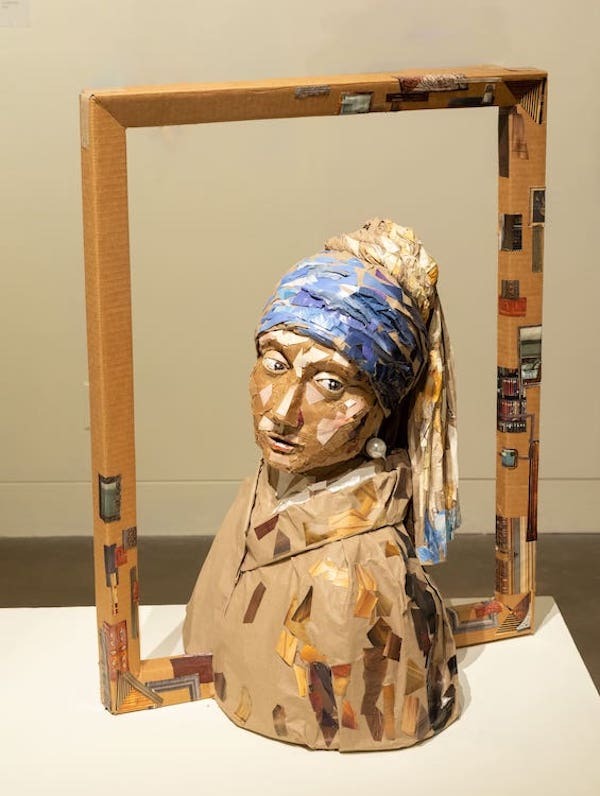 sculpture of young woman with head scarf and pearl earring