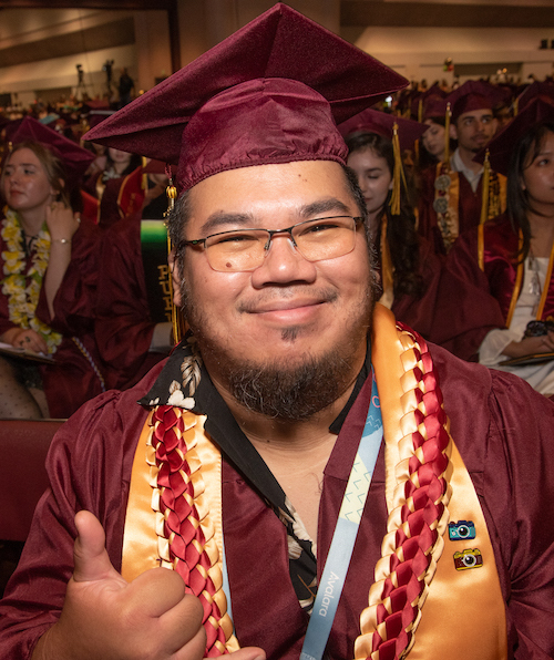 male grad with beard, giving thumbs up